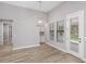Bright dining area with stylish light fixture and large windows at 17404 Nokota Ave, Hudson, FL 34667