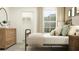 Cozy bedroom with rustic wood furniture, large window and closet with shelving at 17554 Happytrails St, Land O Lakes, FL 34638