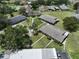 Aerial view of single Gathering homes displaying mature landscaping and tree lined streets at 1904 Canterbury Ln # 18, Sun City Center, FL 33573
