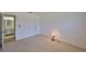Spacious bedroom featuring neutral carpeting and an adjacent bathroom at 1904 Canterbury Ln # 18, Sun City Center, FL 33573