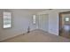 Bright bedroom with a closet and two windows, offering ample storage and light at 1904 Canterbury Ln # 18, Sun City Center, FL 33573