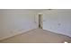 Empty bedroom with white walls, carpet, and two doors at 1904 Canterbury Ln # 18, Sun City Center, FL 33573