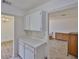 Kitchen view into the bright living room, showcasing the open floor plan layout at 1904 Canterbury Ln # 18, Sun City Center, FL 33573