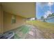 Cozy covered patio in backyard providing relaxing space at 1904 Canterbury Ln # 18, Sun City Center, FL 33573