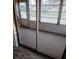 Enclosed sunroom with sliding glass doors, offering a bright and airy space for relaxation at 1904 Canterbury Ln # 18, Sun City Center, FL 33573