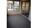 Inviting sunroom with carpeted floor, filled with natural light from surrounding windows at 1904 Canterbury Ln # 18, Sun City Center, FL 33573