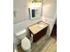 Bathroom featuring granite vanity and toilet at 2262 Swedish Dr # 6, Clearwater, FL 33763