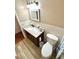 Cozy bathroom featuring tile flooring, neutral walls, and a granite countertop at 2262 Swedish Dr # 6, Clearwater, FL 33763