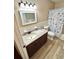 Bathroom featuring a granite vanity top and a tub with a shower at 2262 Swedish Dr # 6, Clearwater, FL 33763