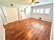 Bedroom featuring hardwood floors, closet, ceiling fan, and shutters at 2262 Swedish Dr # 6, Clearwater, FL 33763