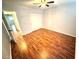 Bedroom with hardwood floors, closet, and ceiling fan at 2262 Swedish Dr # 6, Clearwater, FL 33763