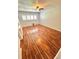 Bedroom featuring hardwood floors, ceiling fan, and plantation shutters at 2262 Swedish Dr # 6, Clearwater, FL 33763