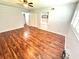 Bedroom featuring hardwood floors, closet, ceiling fan, and shutters at 2262 Swedish Dr # 6, Clearwater, FL 33763