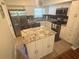 Well-equipped kitchen with stainless steel appliances and stylish white cabinetry at 2262 Swedish Dr # 6, Clearwater, FL 33763