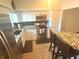 Modern kitchen with stainless steel appliances and granite countertops at 2262 Swedish Dr # 6, Clearwater, FL 33763