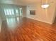 Spacious living room featuring wood-look floors and abundant natural light at 2262 Swedish Dr # 6, Clearwater, FL 33763