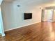 Bright living room space featuring wood-look floors and neutral wall colors at 2262 Swedish Dr # 6, Clearwater, FL 33763