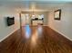 Inviting living room with hardwood floors leading to a cozy kitchen area at 2262 Swedish Dr # 6, Clearwater, FL 33763
