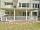 A spacious private patio with a protective white railing, offering a relaxing outdoor space at 2262 Swedish Dr # 6, Clearwater, FL 33763