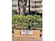 Community signage for Valencia 2262 with manicured landscaping and building facade visible in the background at 2262 Swedish Dr # 6, Clearwater, FL 33763