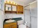 Functional bathroom featuring a classic vanity, mirrored cabinet, and combination tub and shower at 27315 Popiel Rd, Brooksville, FL 34602