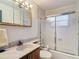 Bathroom with a combination tub and shower, marble countertop, and classic vanity mirror at 27315 Popiel Rd, Brooksville, FL 34602