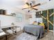 Cozy bedroom with unique decorations, a ceiling fan, and a comfortable bed at 27315 Popiel Rd, Brooksville, FL 34602