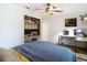 Cozy bedroom featuring a modern desk, computer setup, and stylish decor at 27315 Popiel Rd, Brooksville, FL 34602