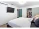 Bright bedroom with TV and closet with fashionable clothing at 27315 Popiel Rd, Brooksville, FL 34602