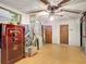 Bonus room featuring vintage floors, ample lighting, multiple doors, and plenty of space at 27315 Popiel Rd, Brooksville, FL 34602