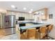 Cozy kitchen showcasing light cabinets, black appliances, and a convenient breakfast bar at 27315 Popiel Rd, Brooksville, FL 34602