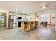 Open kitchen and dining area featuring stainless steel appliances and breakfast bar seating at 27315 Popiel Rd, Brooksville, FL 34602