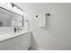 Bathroom featuring a sleek vanity with modern fixtures and recessed lighting at 3004 Conifer Dr, Largo, FL 33771
