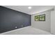 Bedroom with a dark accent wall and natural light at 3004 Conifer Dr, Largo, FL 33771