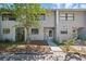 Charming two-story townhouse with a landscaped front yard and a welcoming entrance, beautiful exterior view at 3004 Conifer Dr, Largo, FL 33771