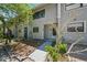 Two-story townhome with neutral siding and well-maintained landscaping at 3004 Conifer Dr, Largo, FL 33771