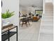 Open floor plan with living and dining areas, and staircase at 3004 Conifer Dr, Largo, FL 33771