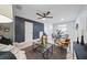 Stylishly furnished living room with modern decor, ceiling fan, and neutral tones at 3004 Conifer Dr, Largo, FL 33771