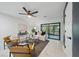 Inviting living room with sliding glass doors to a screened patio or porch at 3004 Conifer Dr, Largo, FL 33771
