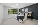 Spacious main bedroom with plush bedding, modern art, and a large window at 3004 Conifer Dr, Largo, FL 33771