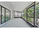 Spacious screened-in porch offering tranquil outdoor views at 3004 Conifer Dr, Largo, FL 33771