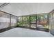 Screened-in porch with lots of natural light and backyard views at 3004 Conifer Dr, Largo, FL 33771