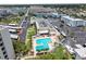 Aerial view of the community with a pool, parking and surrounding buildings at 3114 59Th S St # 203, Gulfport, FL 33707