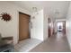 Hallway featuring an elevator, doors to laundry facilities and neutral colored tile floors at 3114 59Th S St # 203, Gulfport, FL 33707