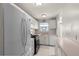 Well-lit kitchen with white appliances, light countertops, and ample cabinet space, ideal for preparing delicious meals at 3114 59Th S St # 203, Gulfport, FL 33707