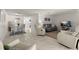 Open concept living area with tile floors and views of the dining area, creating a welcoming and spacious atmosphere at 3114 59Th S St # 203, Gulfport, FL 33707