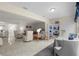 Open living area with neutral paint, tile flooring, and stylish furniture, flowing to dining area at 3114 59Th S St # 203, Gulfport, FL 33707