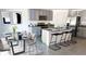 Modern kitchen with gray cabinets, stainless steel appliances, and granite countertops at 35665 Lockman Way, Zephyrhills, FL 33541