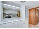 Kitchen featuring white cabinets, marble countertops and stainless steel appliances at 38839 Miller Ave, Zephyrhills, FL 33542