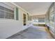 Enclosed porch with screens, concrete flooring, and a view of the outdoor surroundings at 38839 Miller Ave, Zephyrhills, FL 33542